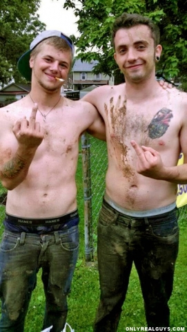 2 country boys shirtless, sagging, and mud covered