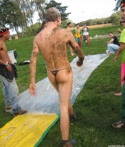 *** hazing...HOT guy stripped to a thong, all wet and muddy