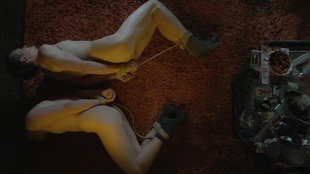 Two guys hogtied in socks with duct tape