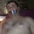 Tape gagged in Magnum Sauna