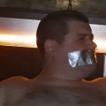 Tape gagged in Magnum Sauna