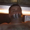 Tape gagged in Magnum Sauna