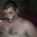 Tape gagged in Magnum Sauna