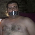 Tape gagged in Magnum Sauna